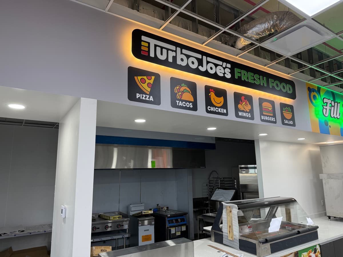 Backlit interior menu signage for a food service counter