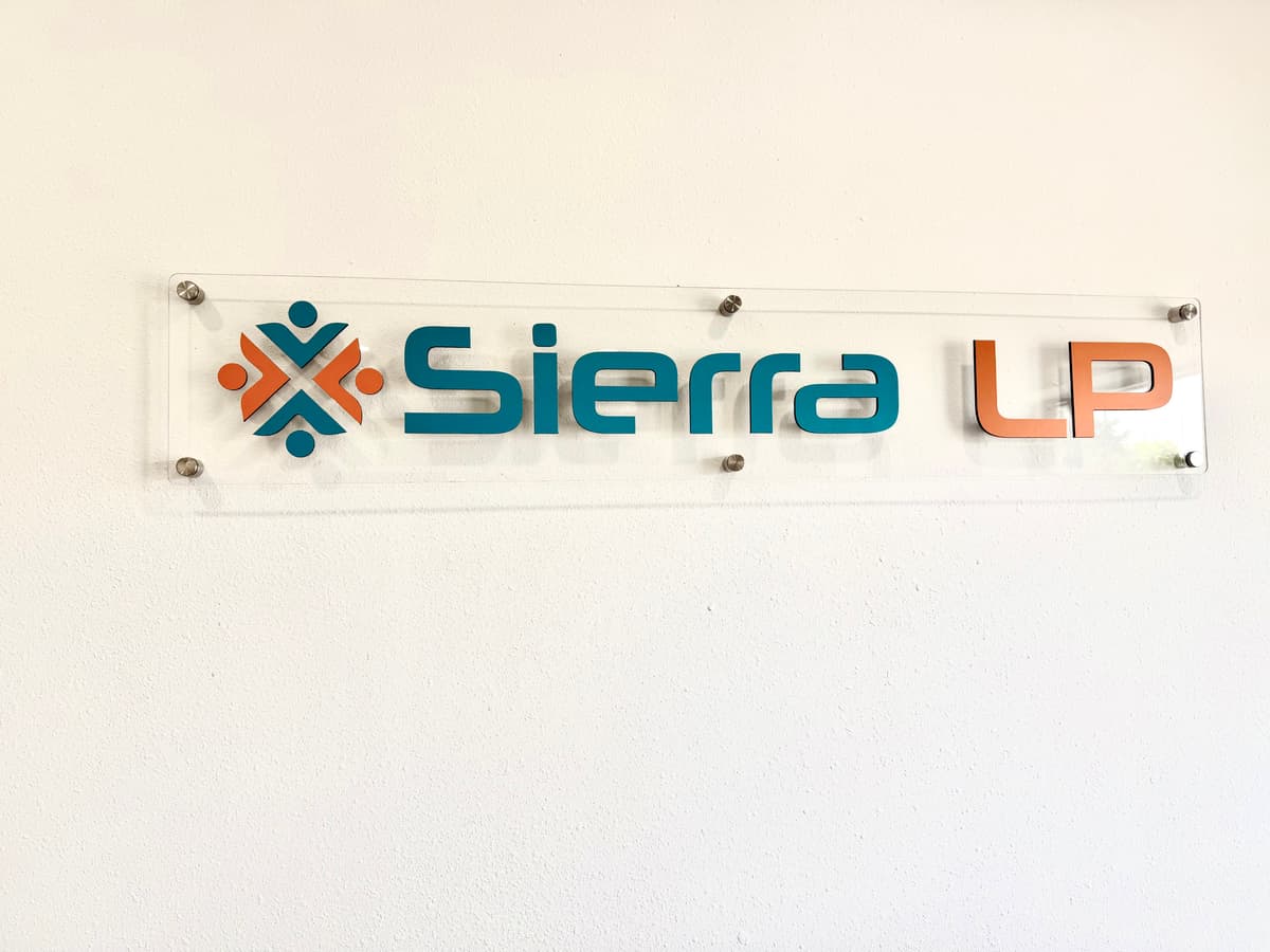 Dimensional acrylic wall sign for a corporate lobby