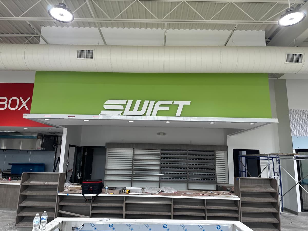 Swift interior counter sign in a convenience store build-out