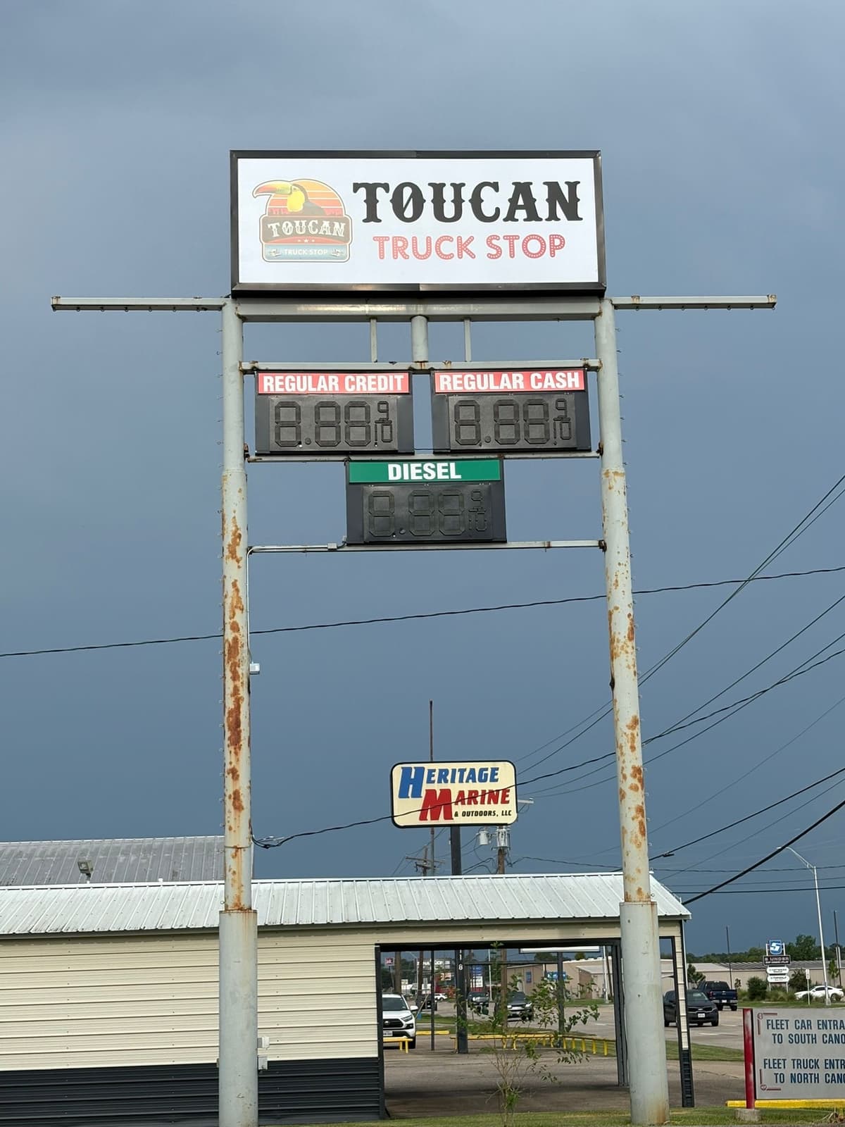 Illuminated pylon sign with digital fuel price displays at a Rosenberg, TX area truck stop