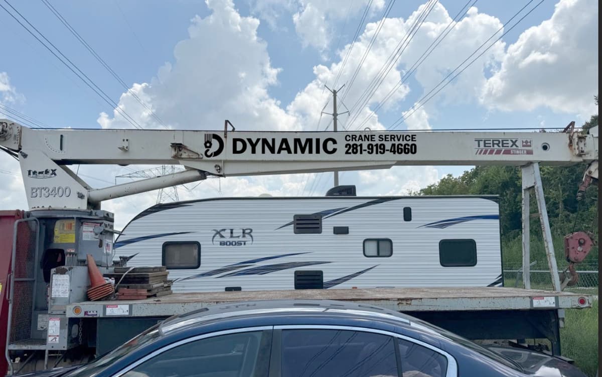 Custom vehicle graphics wrap for a crane service fleet